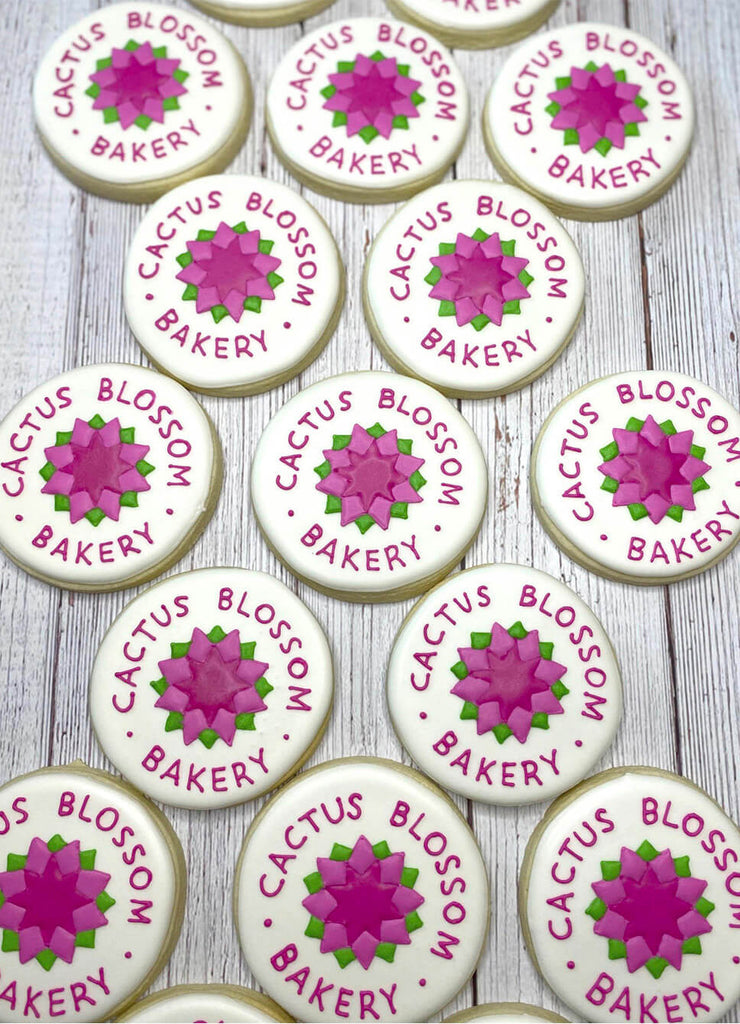Image of the old Cactus Blossom Bakery logo frosted onto 17 cookies, laid out in a grid pattern.